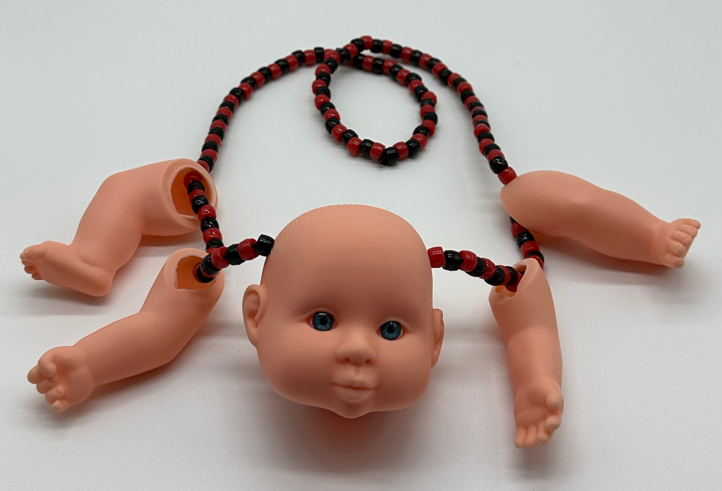 Baby Doll W/ 4 Appendages Necklace